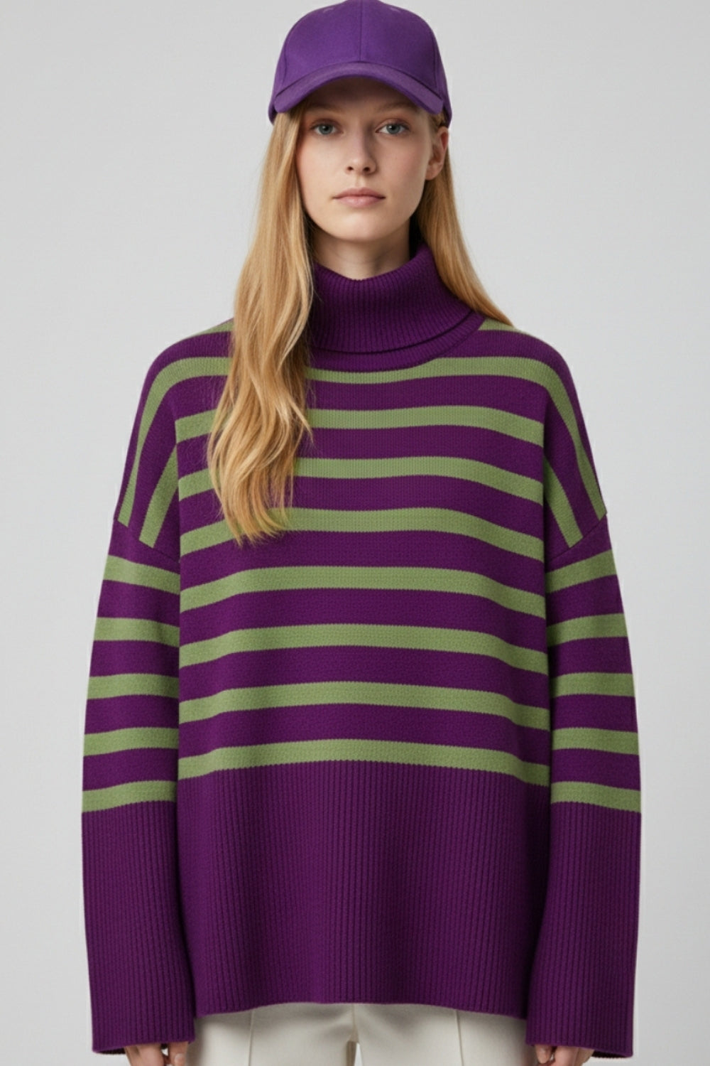 Purple oversized turtleneck sweater with green stripes and splits on the side