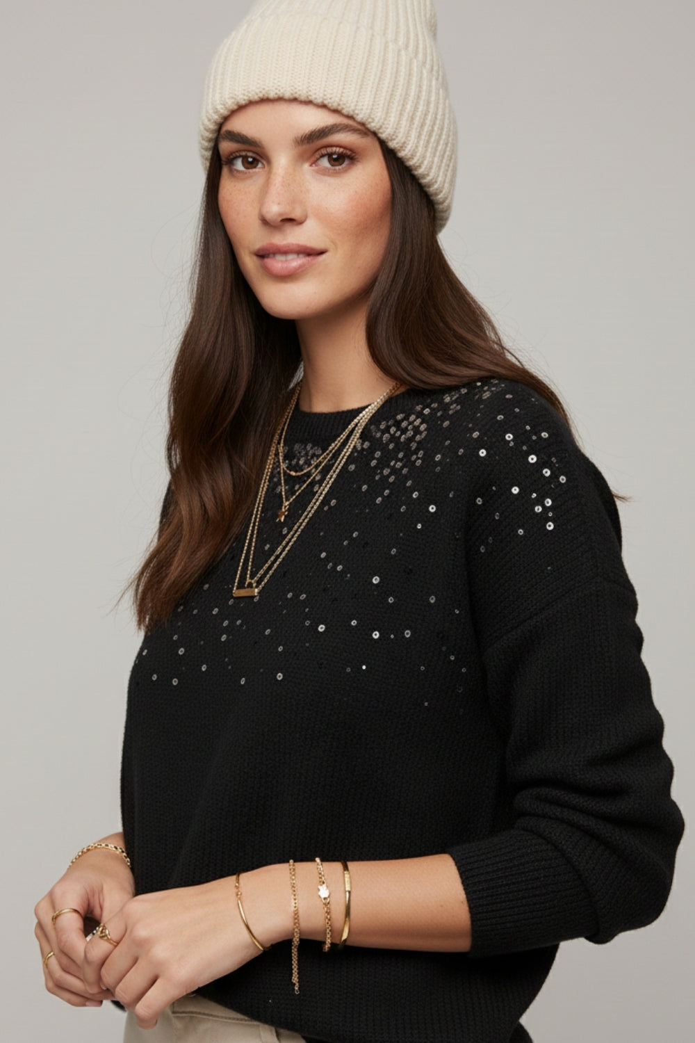 black soft knit sweater embellished with sequins on the front