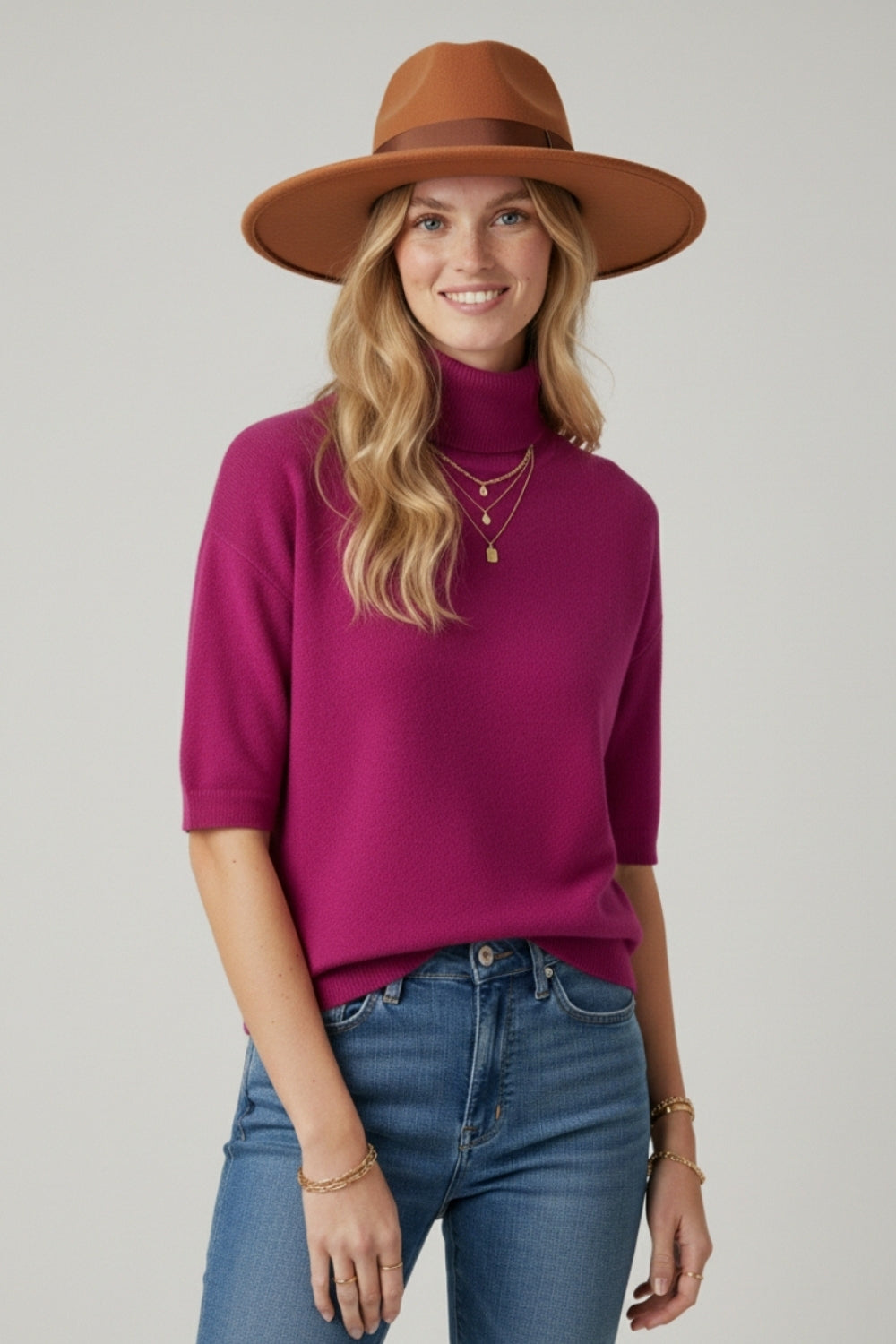 Fine knit sweater in fucsia with a high neck and elbow-length sleeves