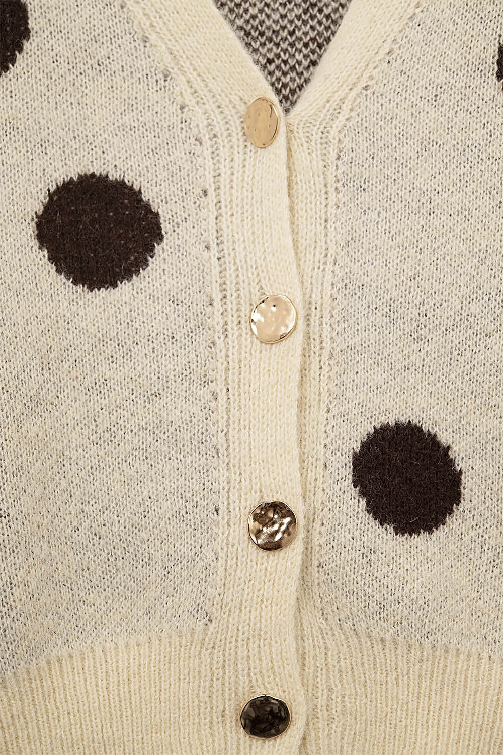 Cream knitted jacket with large brown polka dots and gold buttons