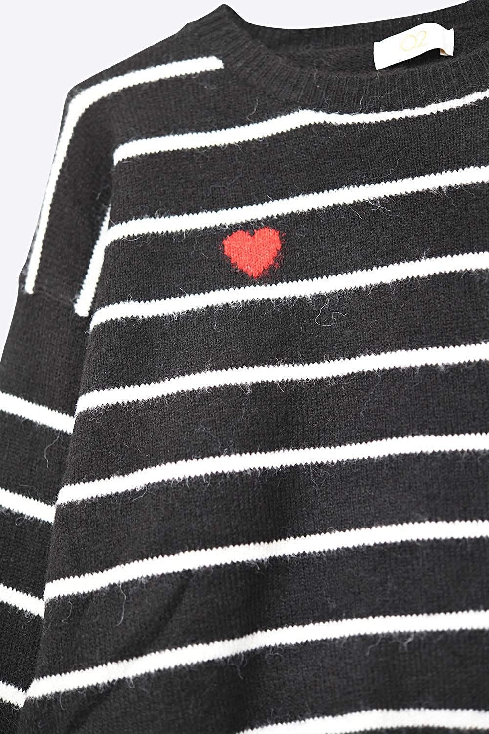 Black knit sweater with red heart detail and white striped