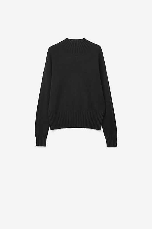 Black soft knit sweater with ribbed cuffs and neck