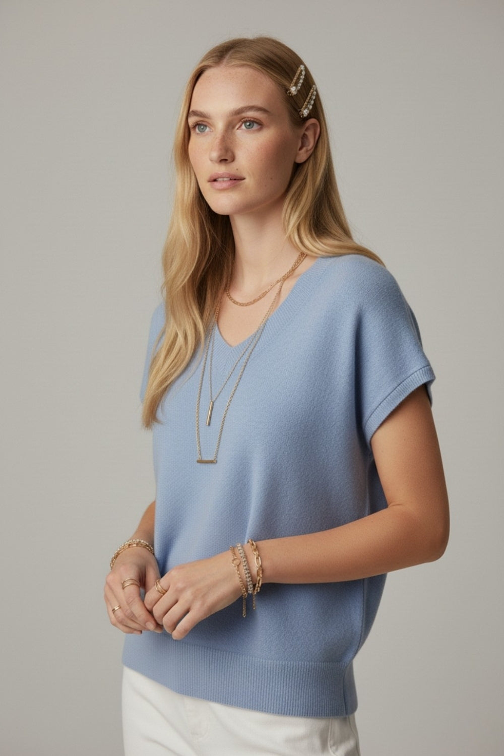 blue lightweight knit V-neck sweater with short sleeves
