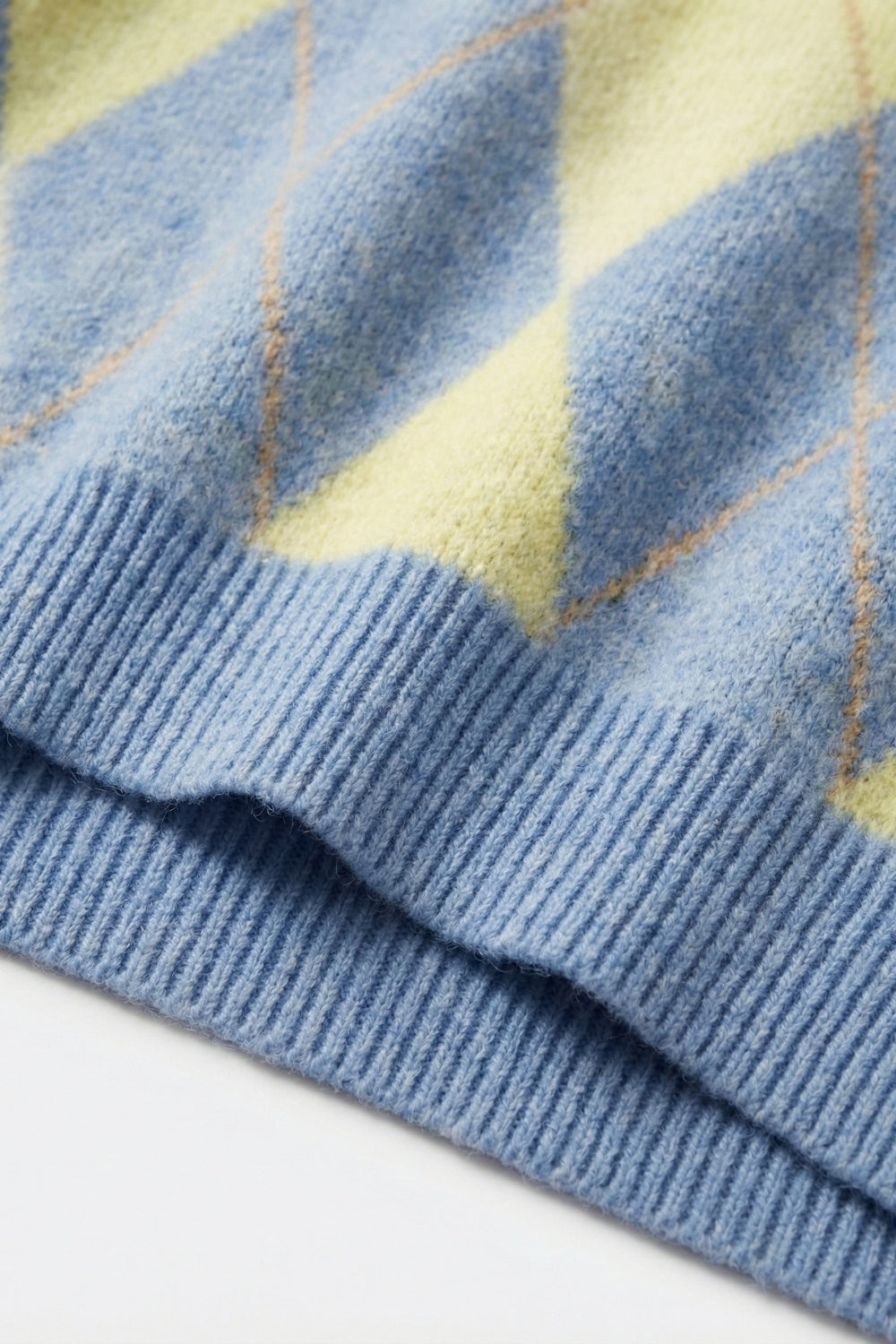 Blue and yellow diamond patterned sweater in soft fluffy knit
