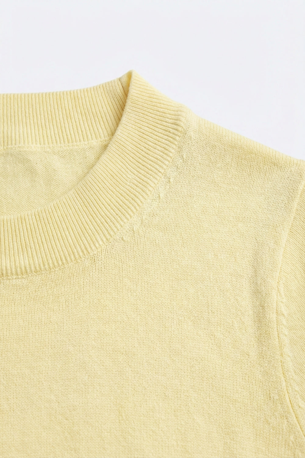 yellow turtleneck sweater with fitted short sleeves