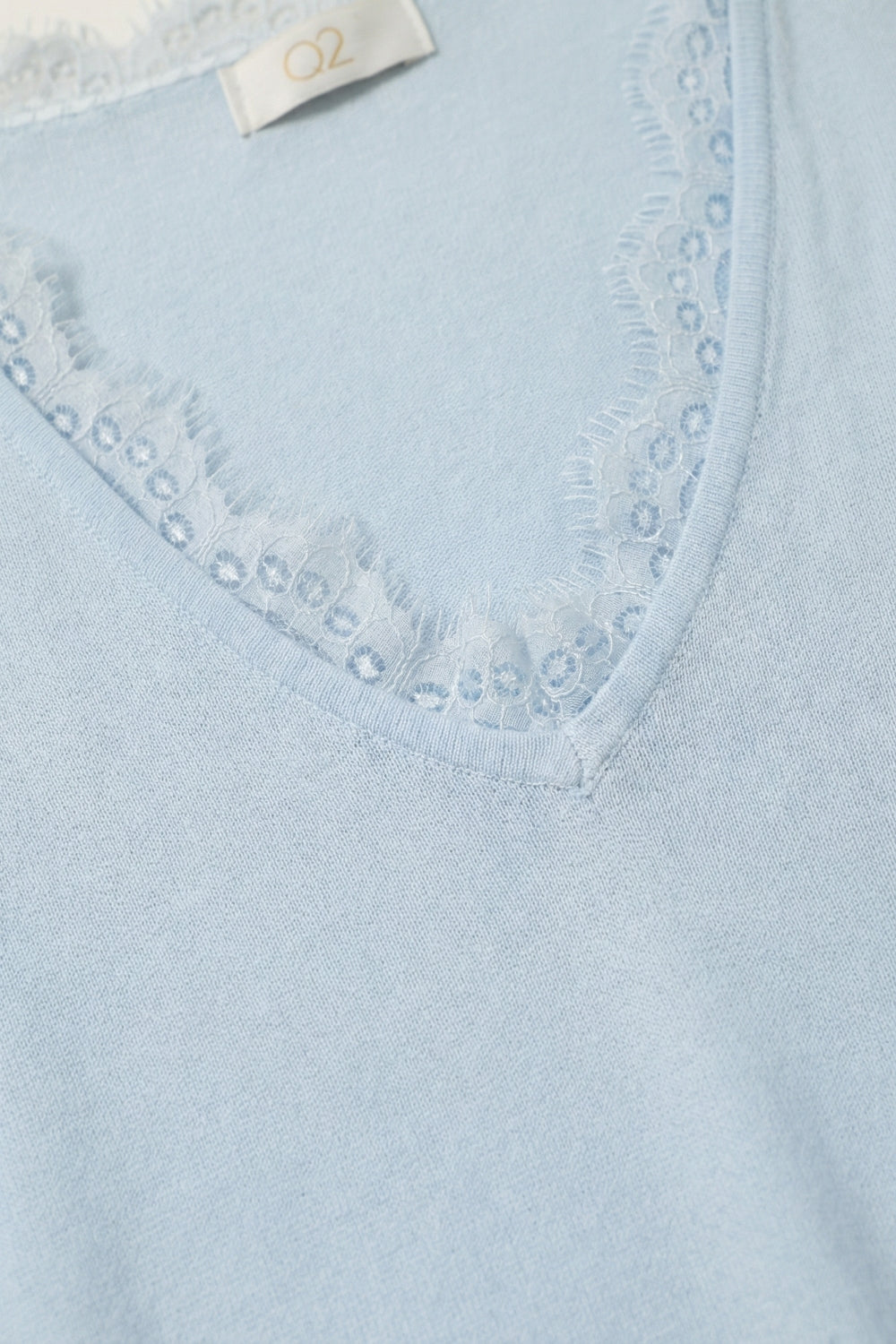 Fine and soft knit sweater with V-neck and lace trim in baby blue