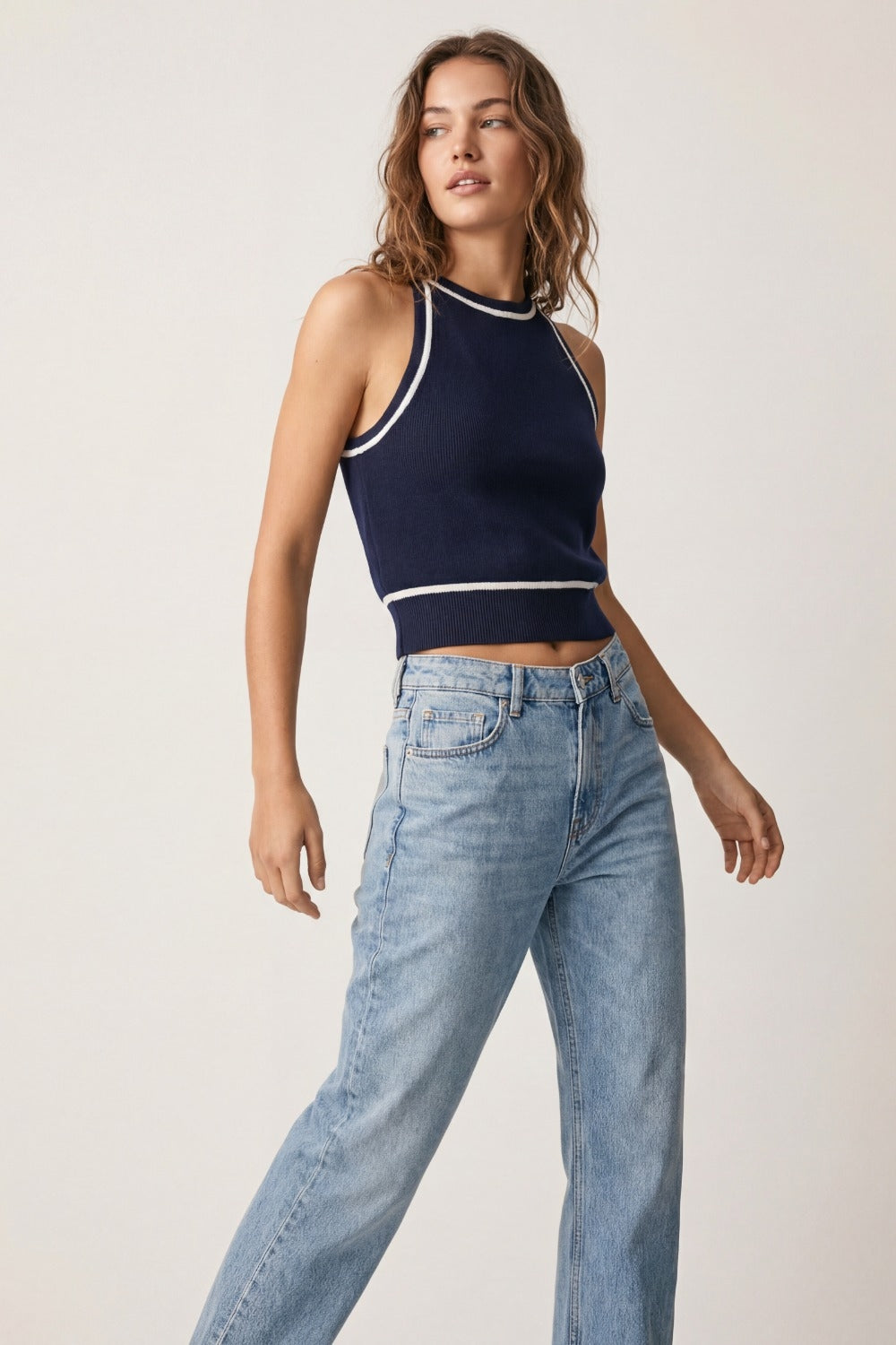 Sleeveless Knitted top In navy Featuring detail white Lines
