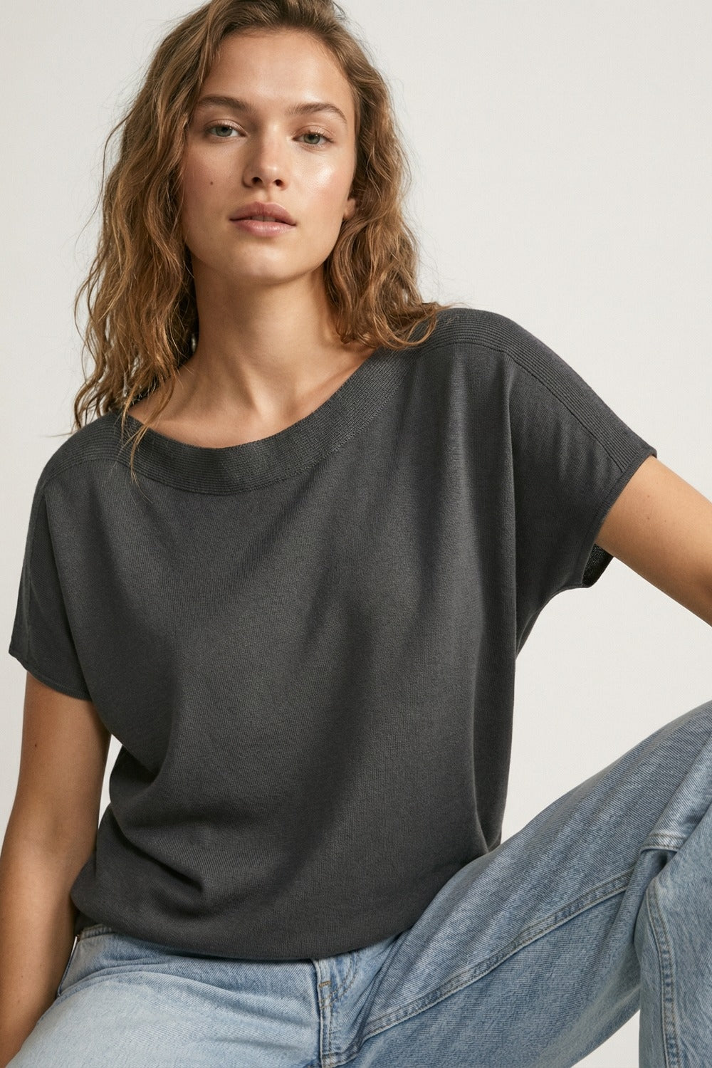 Relaxed black boatneck sweater with dropped sleeves