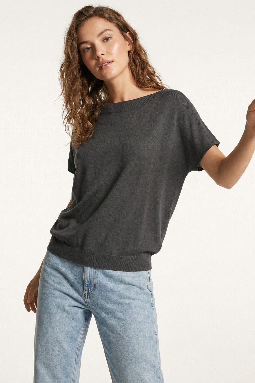 Relaxed black boatneck sweater with dropped sleeves