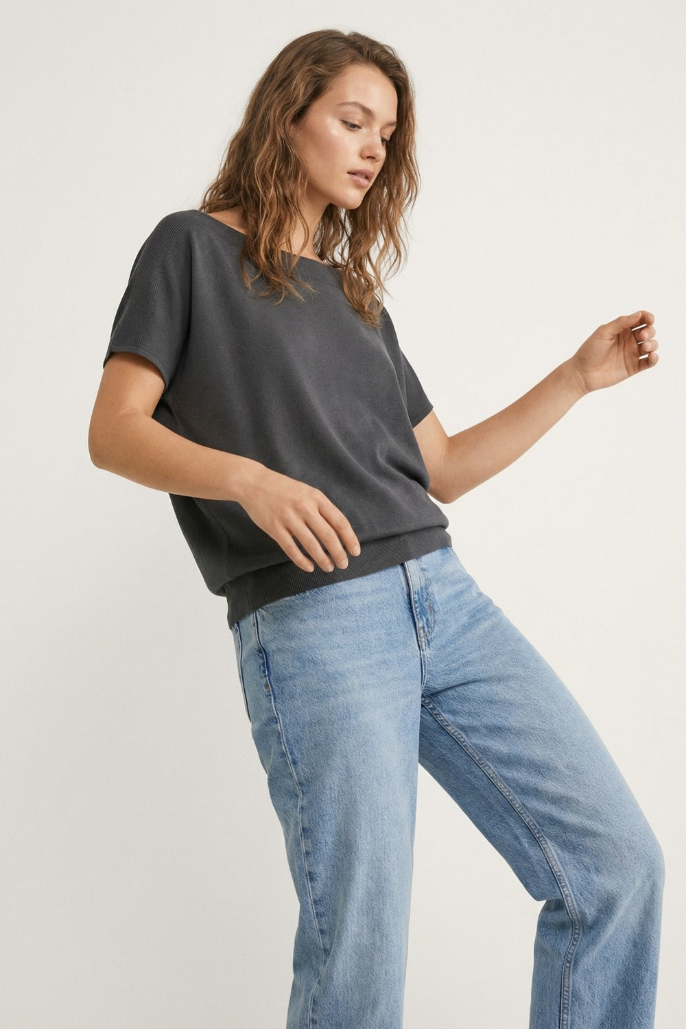 Relaxed black boatneck sweater with dropped sleeves