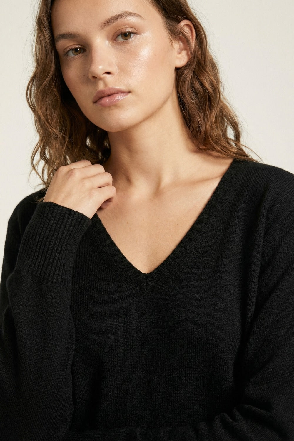 Fine Knit V-Neck Sweater with Decorative Neckline Detail in black color