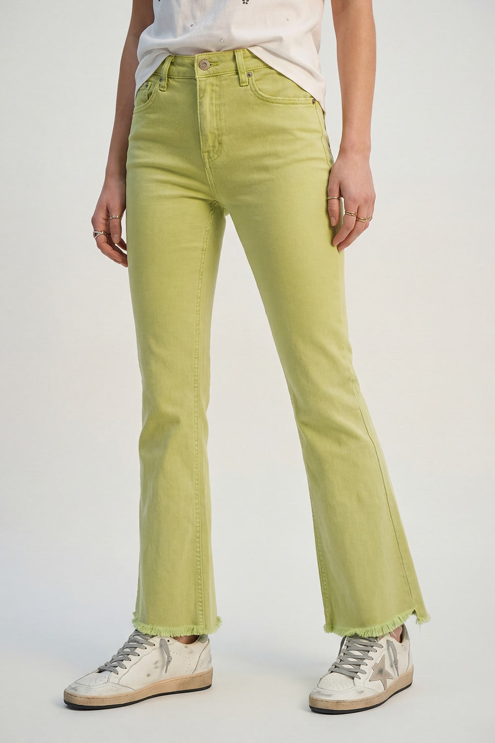 Flare jeans with raw hem edge in lime color - Coloured Jeans