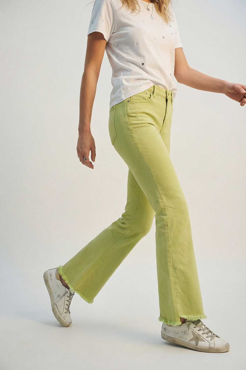 Flare jeans with raw hem edge in lime color - Coloured Jeans