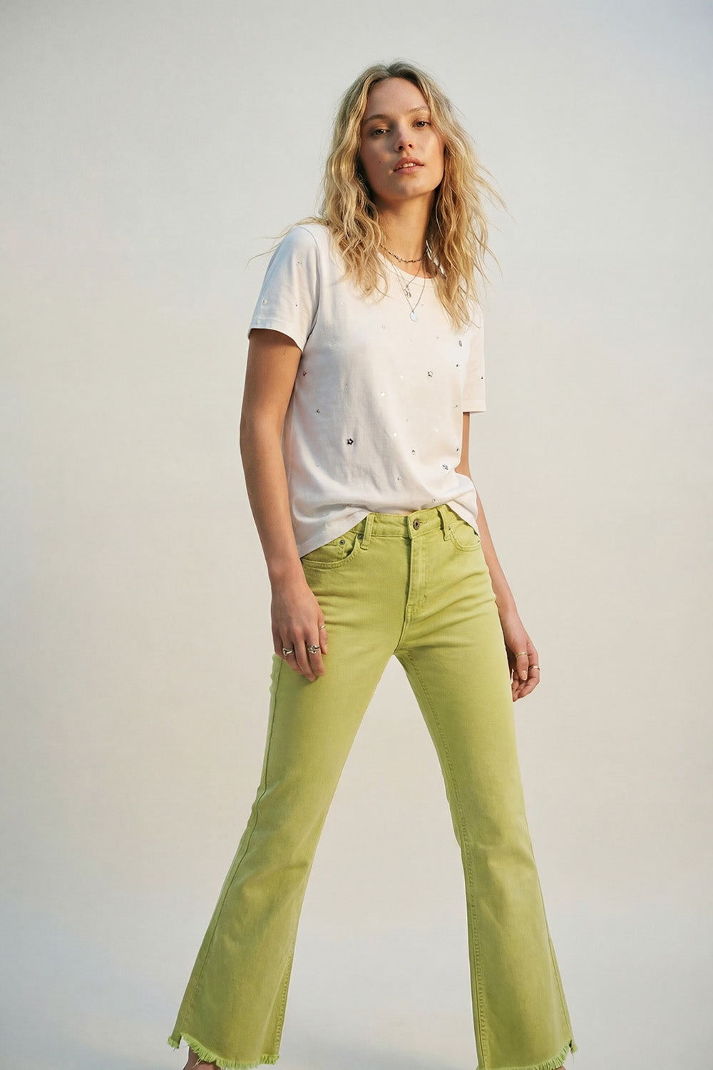 Flare jeans with raw hem edge in lime color - Coloured Jeans