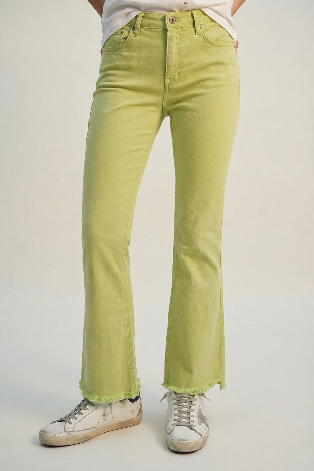 Flare jeans with raw hem edge in lime color - Coloured Jeans