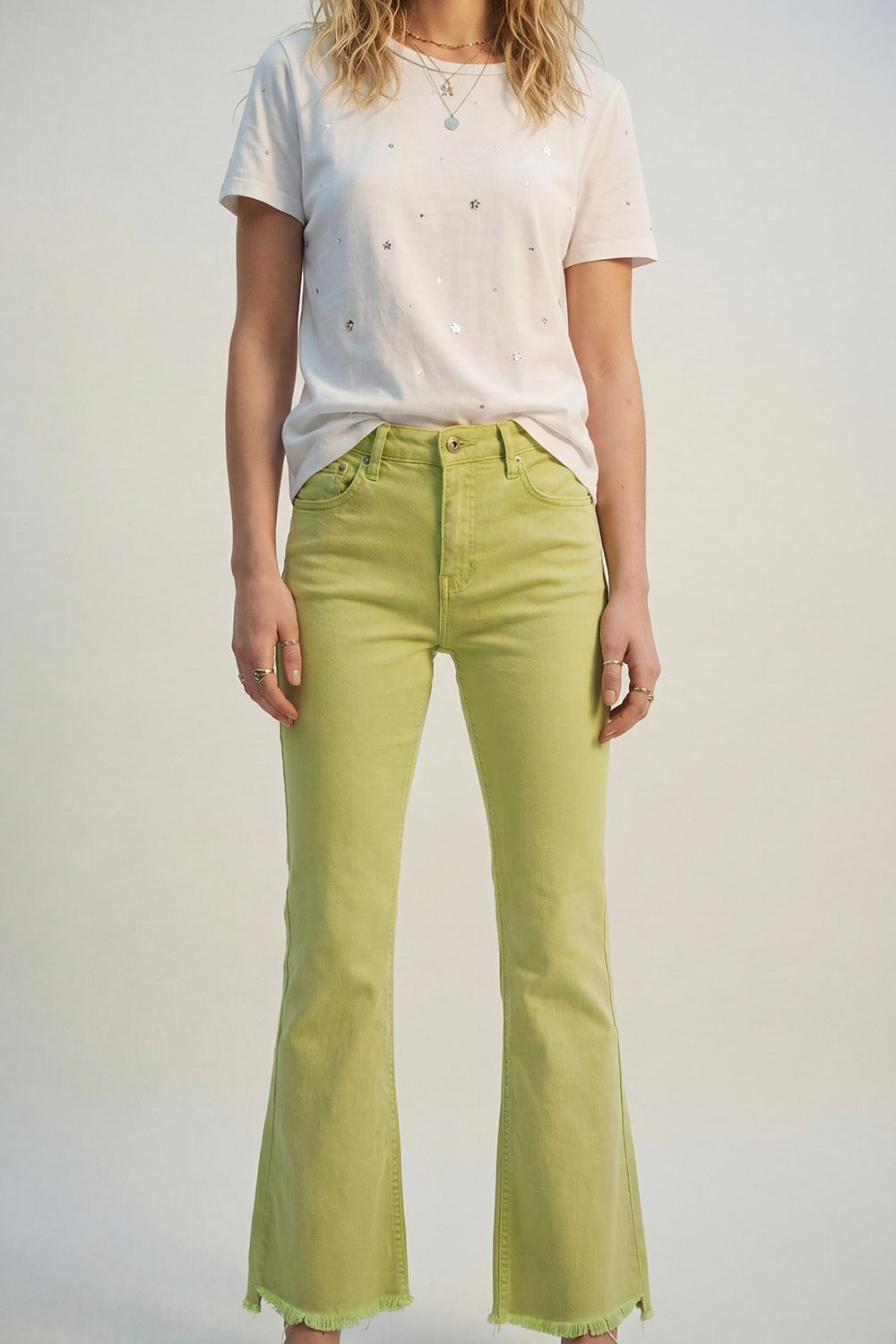 Flare jeans with raw hem edge in lime color - Coloured Jeans