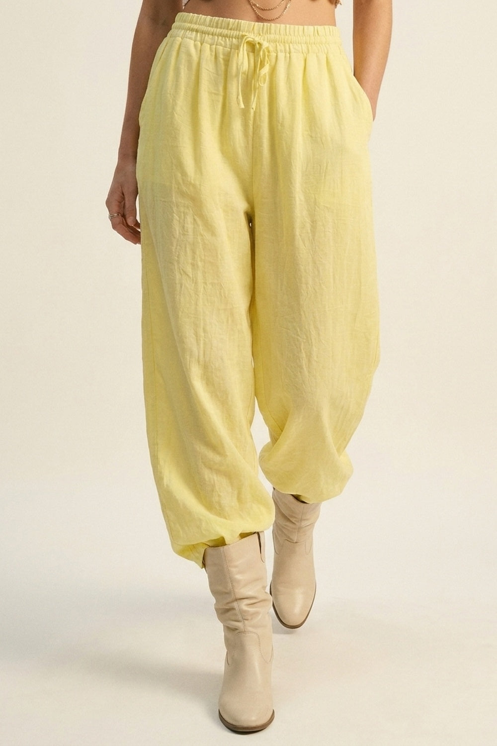 Yellow Wide-Leg Drawstring Pants with sheer fabric