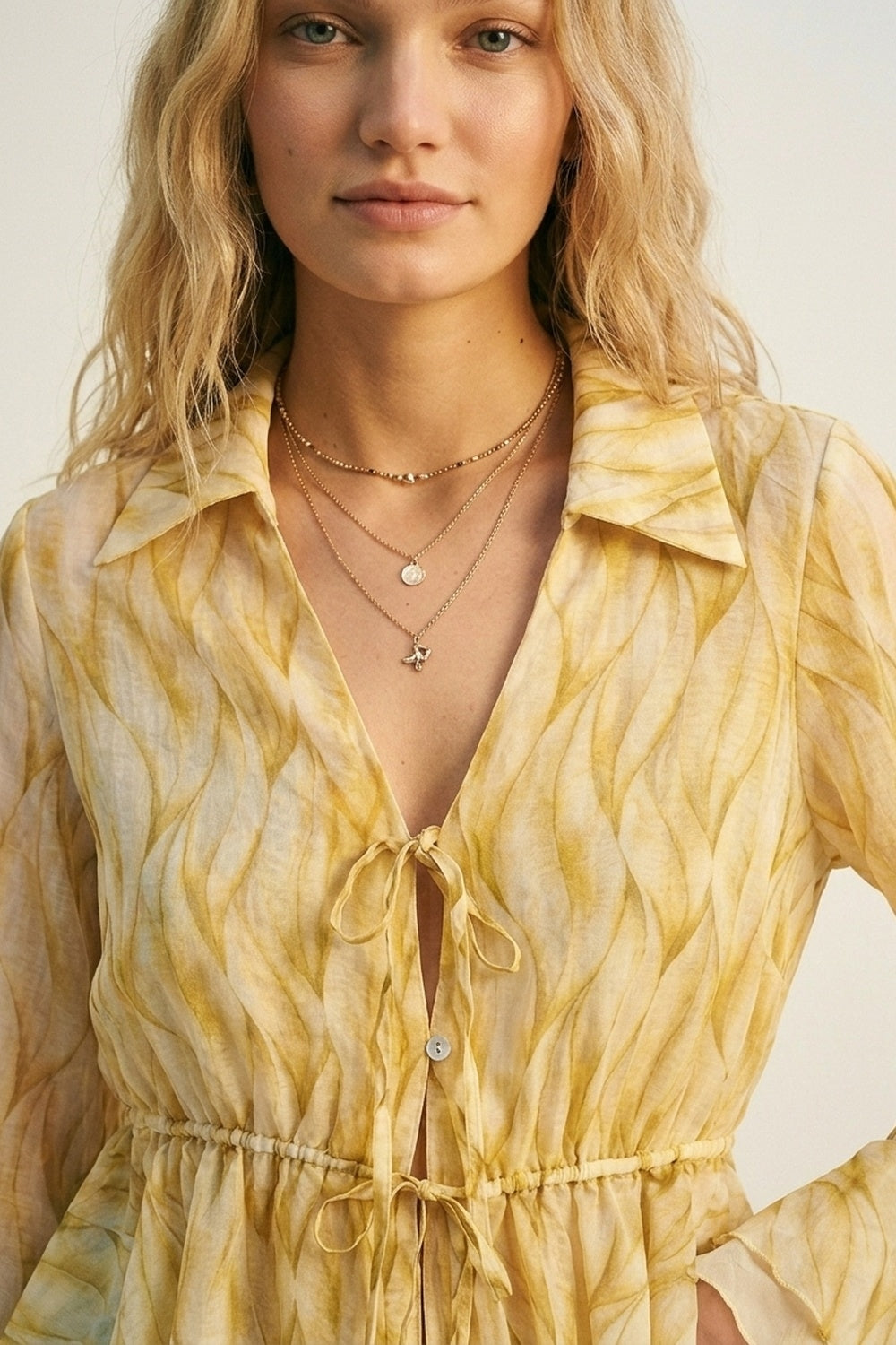 Yellow Sheer Printed Tie-Waist Blouse with Ruffled Hem