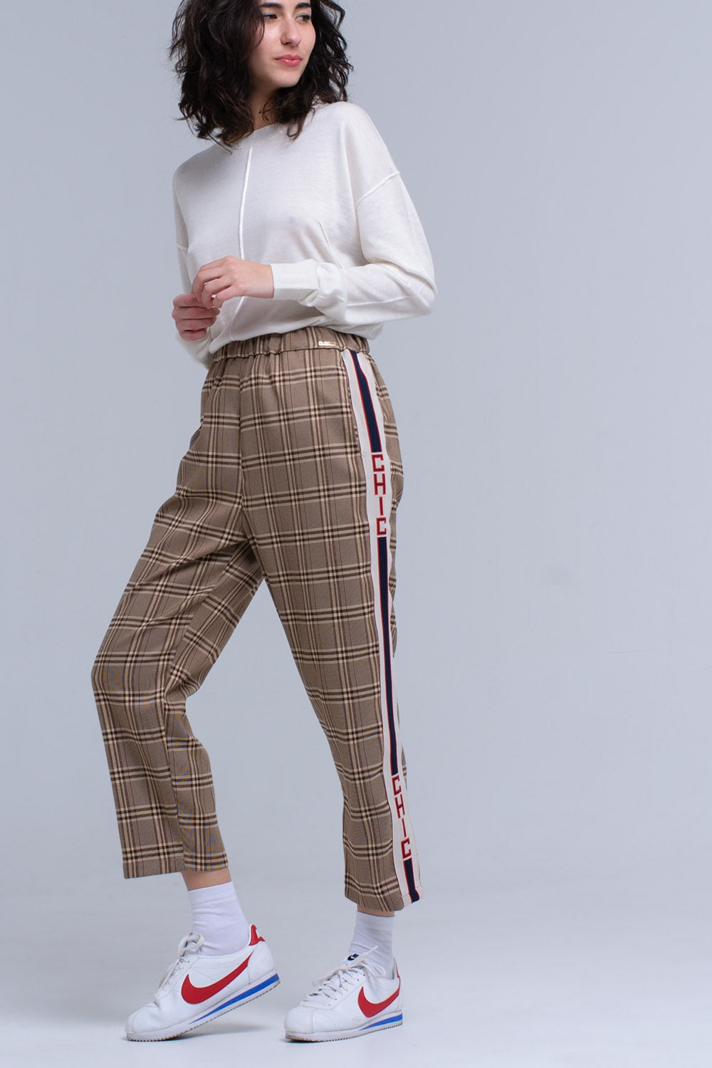 Brown tartan pattern trousers