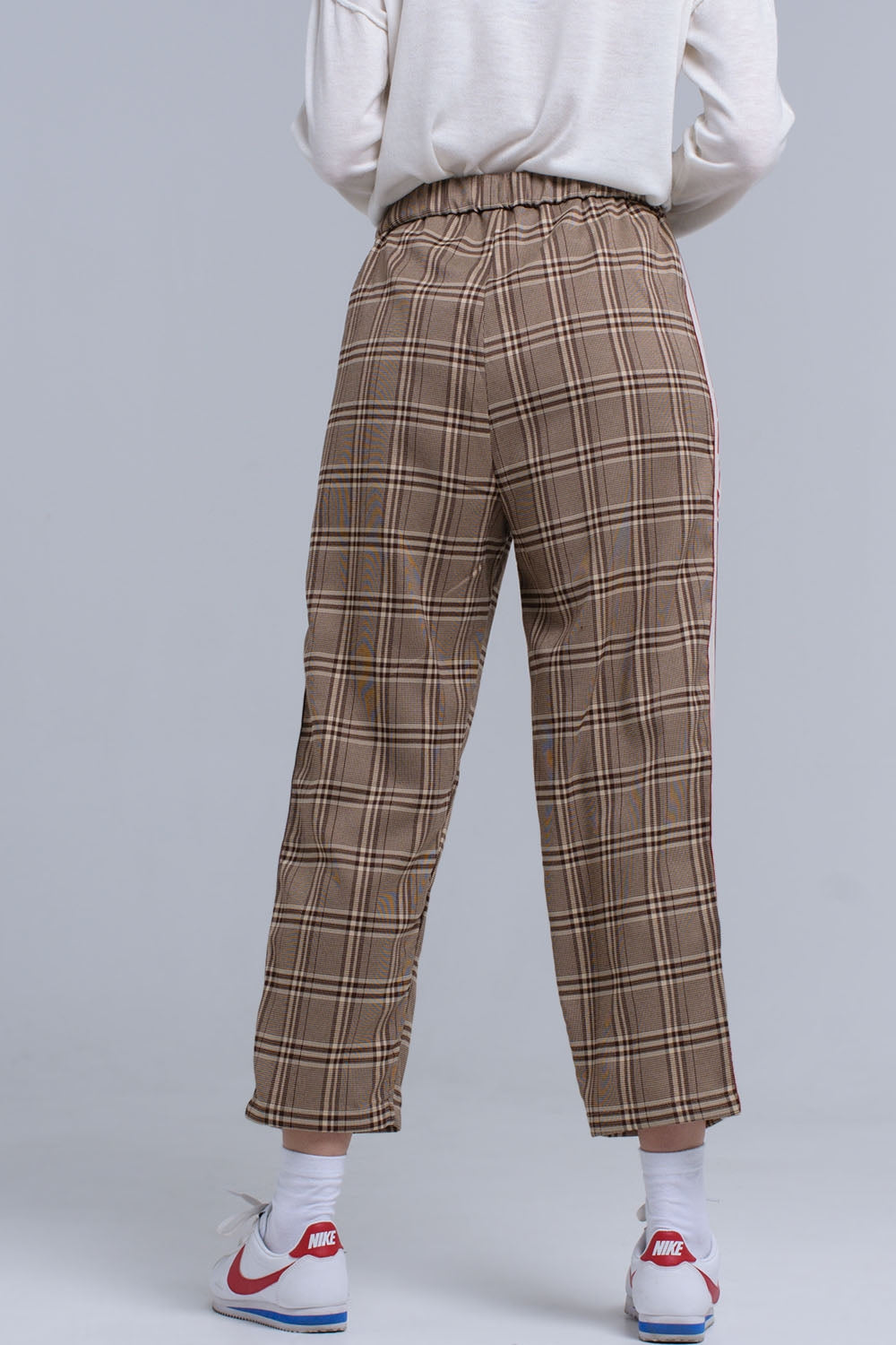 Brown tartan pattern trousers