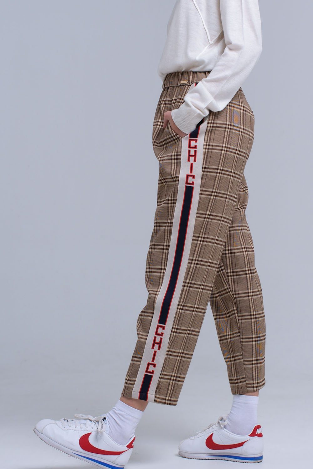 Brown tartan pattern trousers