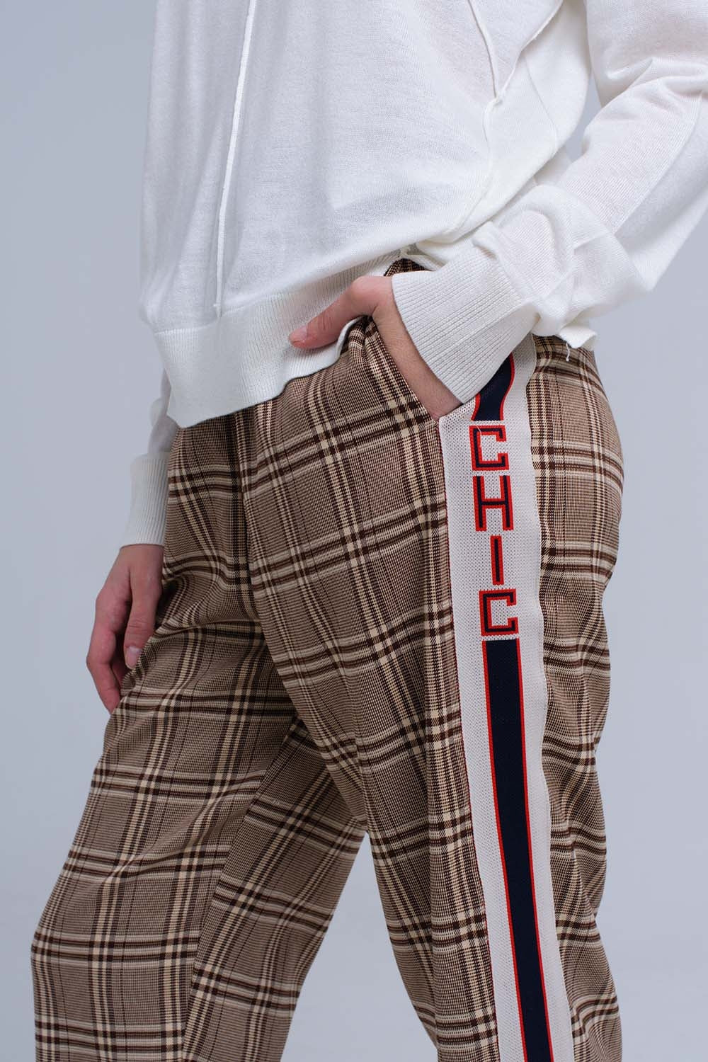 Brown tartan pattern trousers