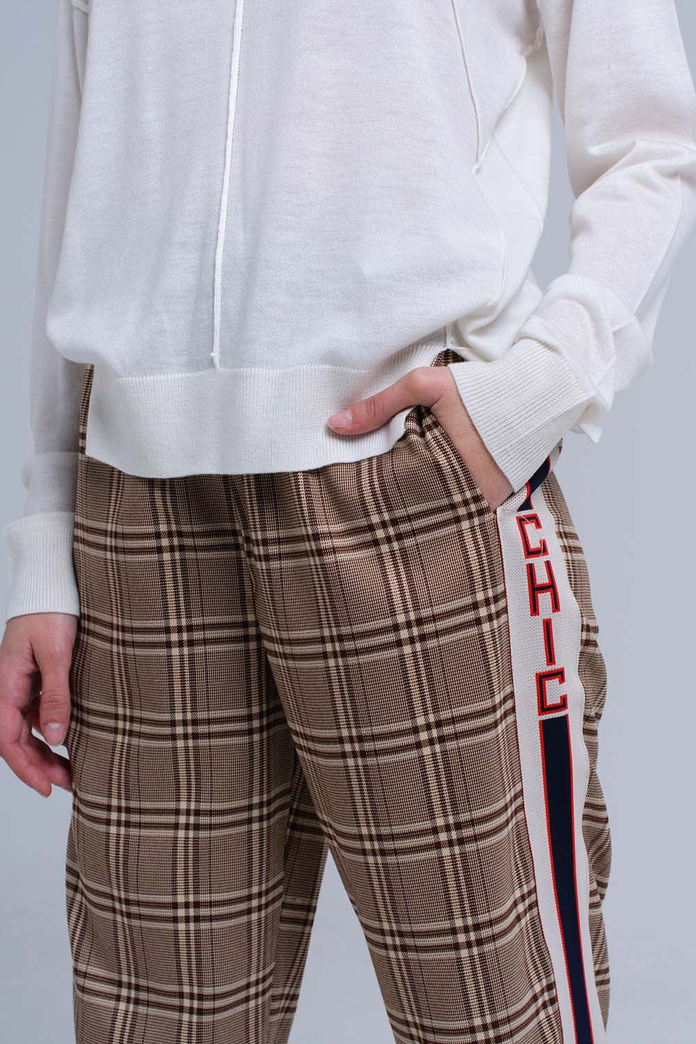 Brown tartan pattern trousers