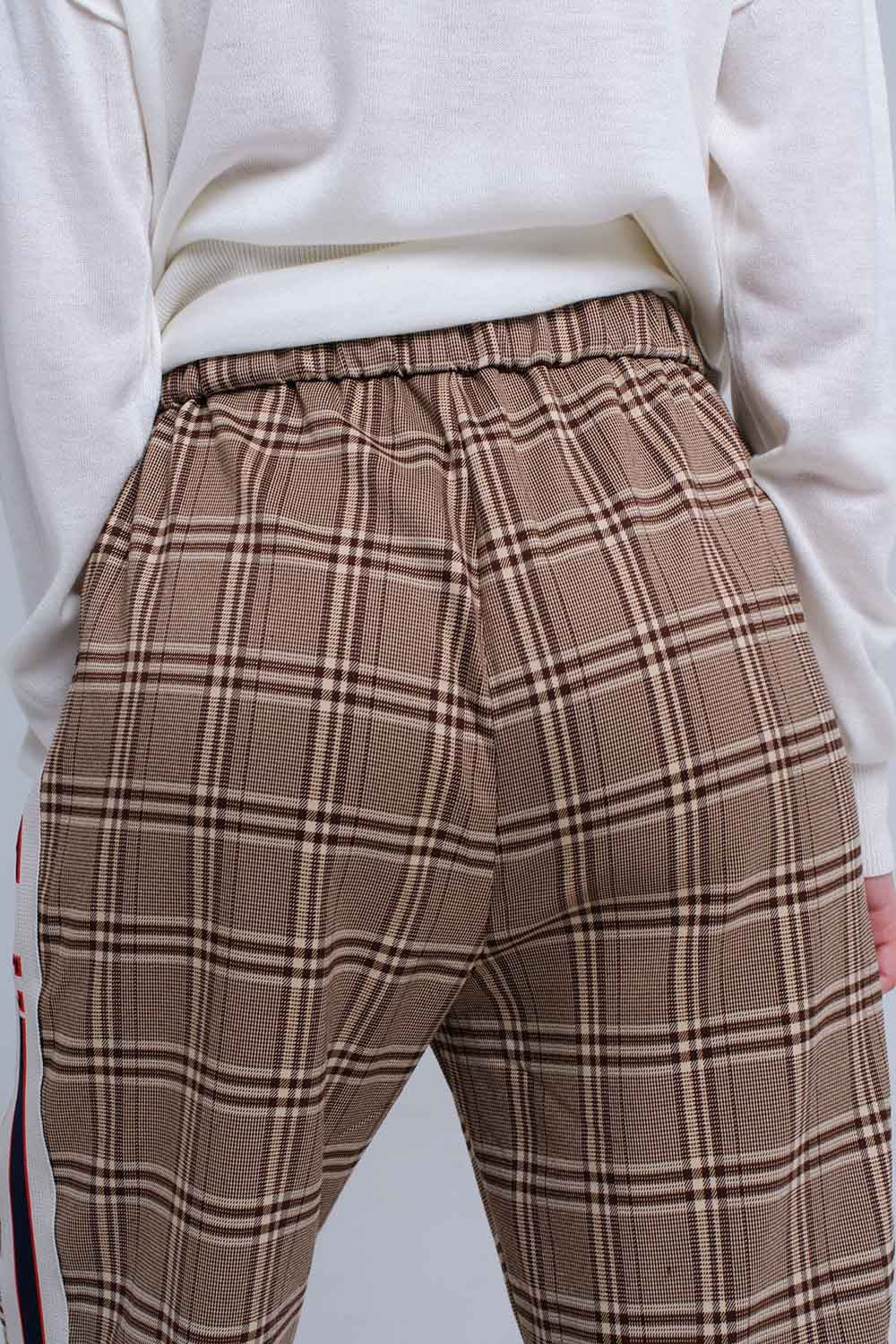Brown tartan pattern trousers