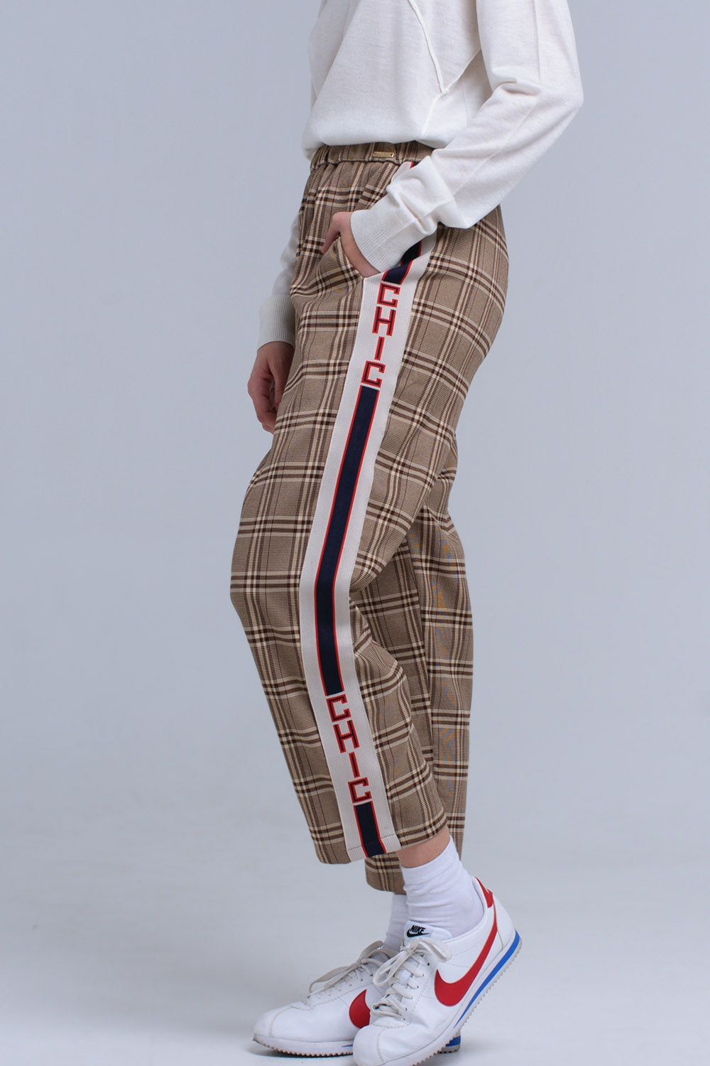 Brown tartan pattern trousers