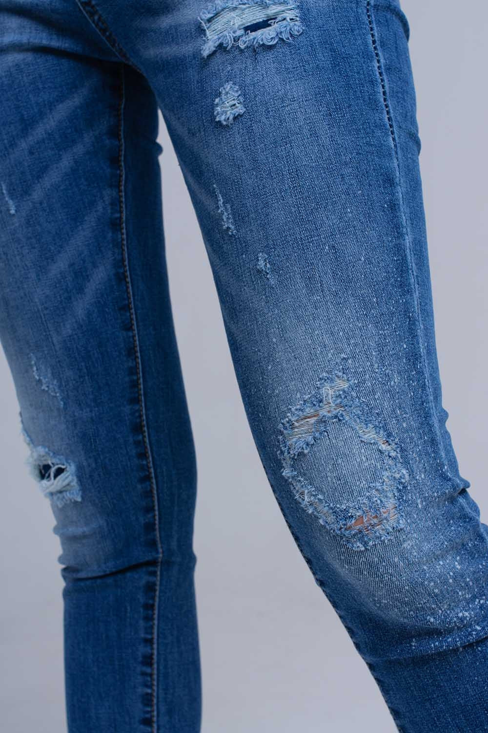 Distressed skinny jeans with fringes