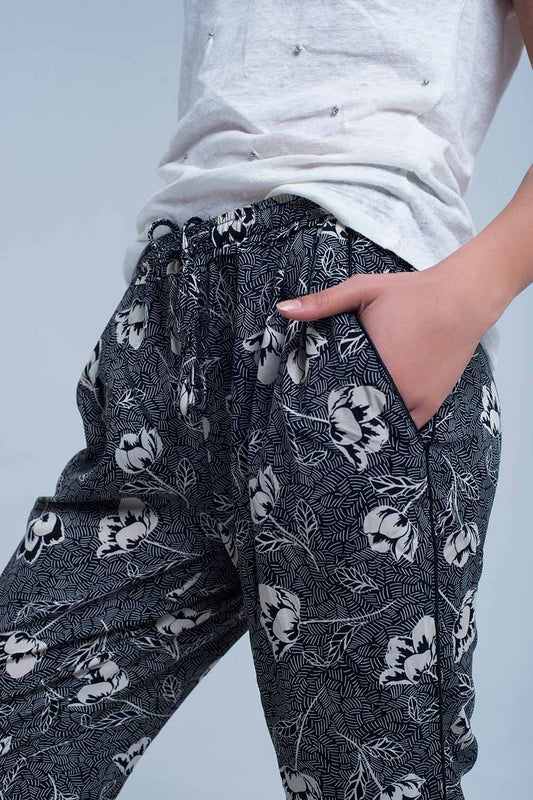 Black pants with floral print - trousers