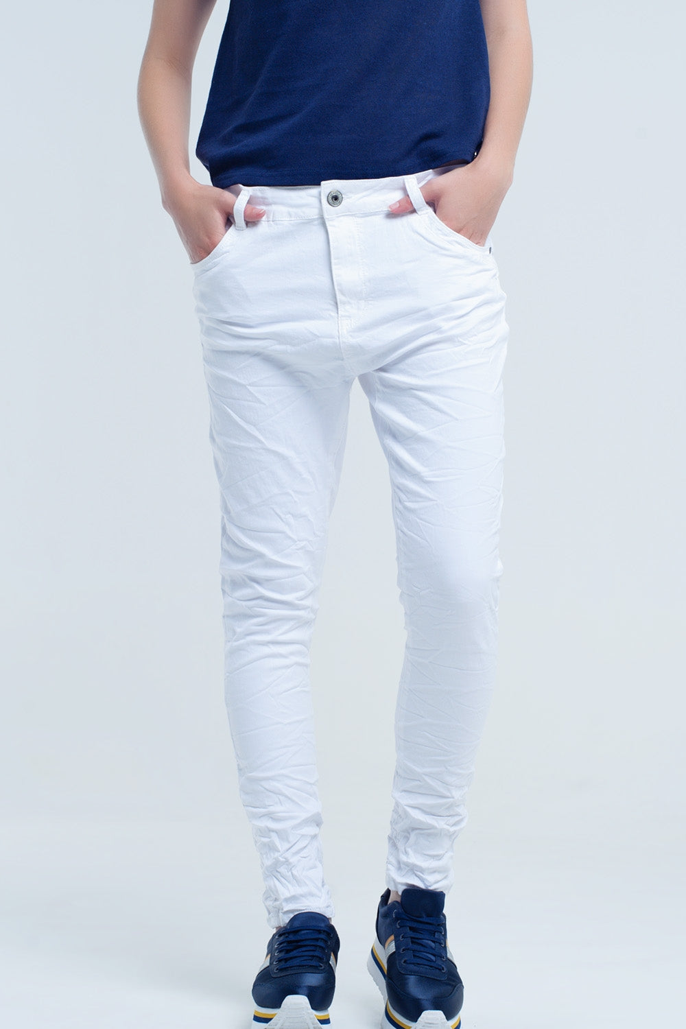 Crumpled white jeans with pockets