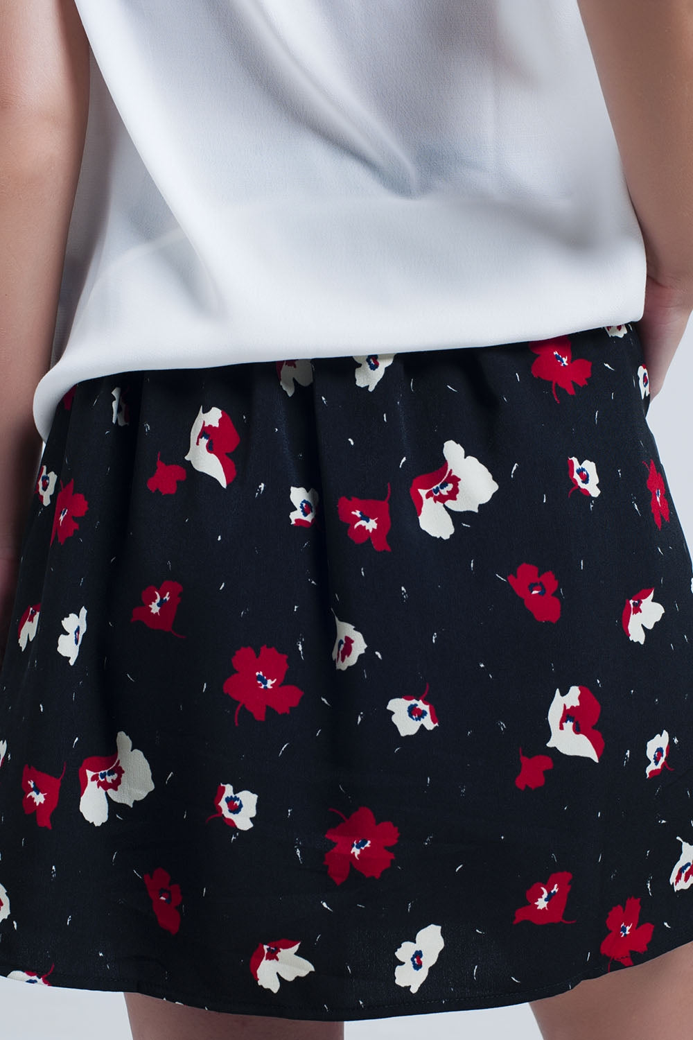 Black mini skirt with floral pattern