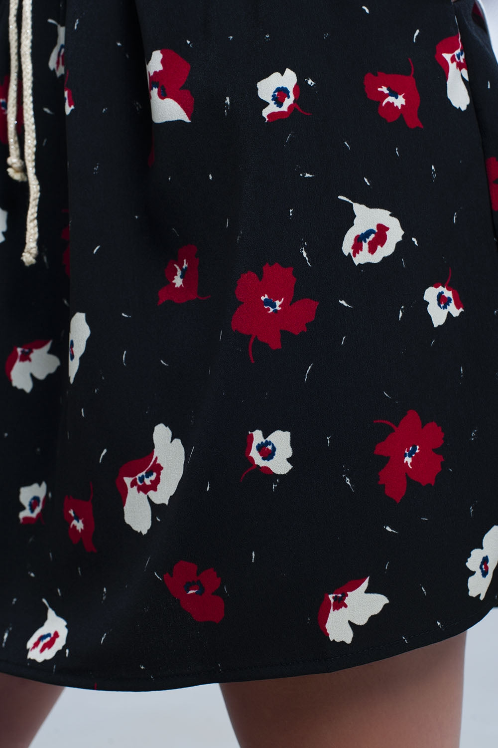 Black mini skirt with floral pattern