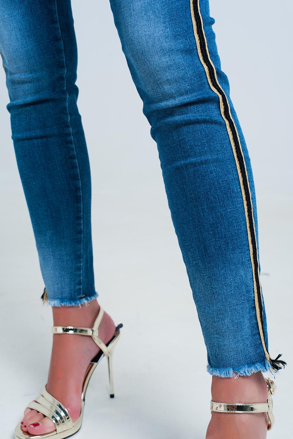 Blue denim pants with gold and black sideband