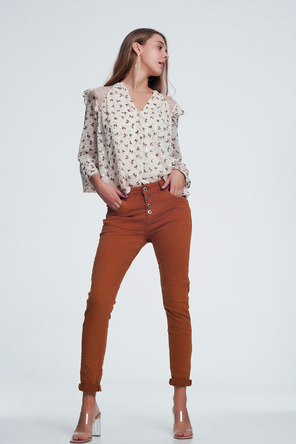 Orange jeans with button closure