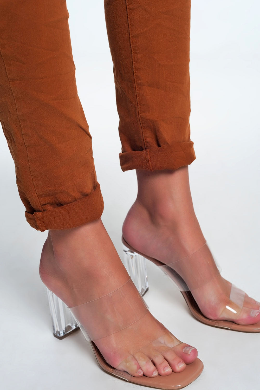 Orange jeans with button closure