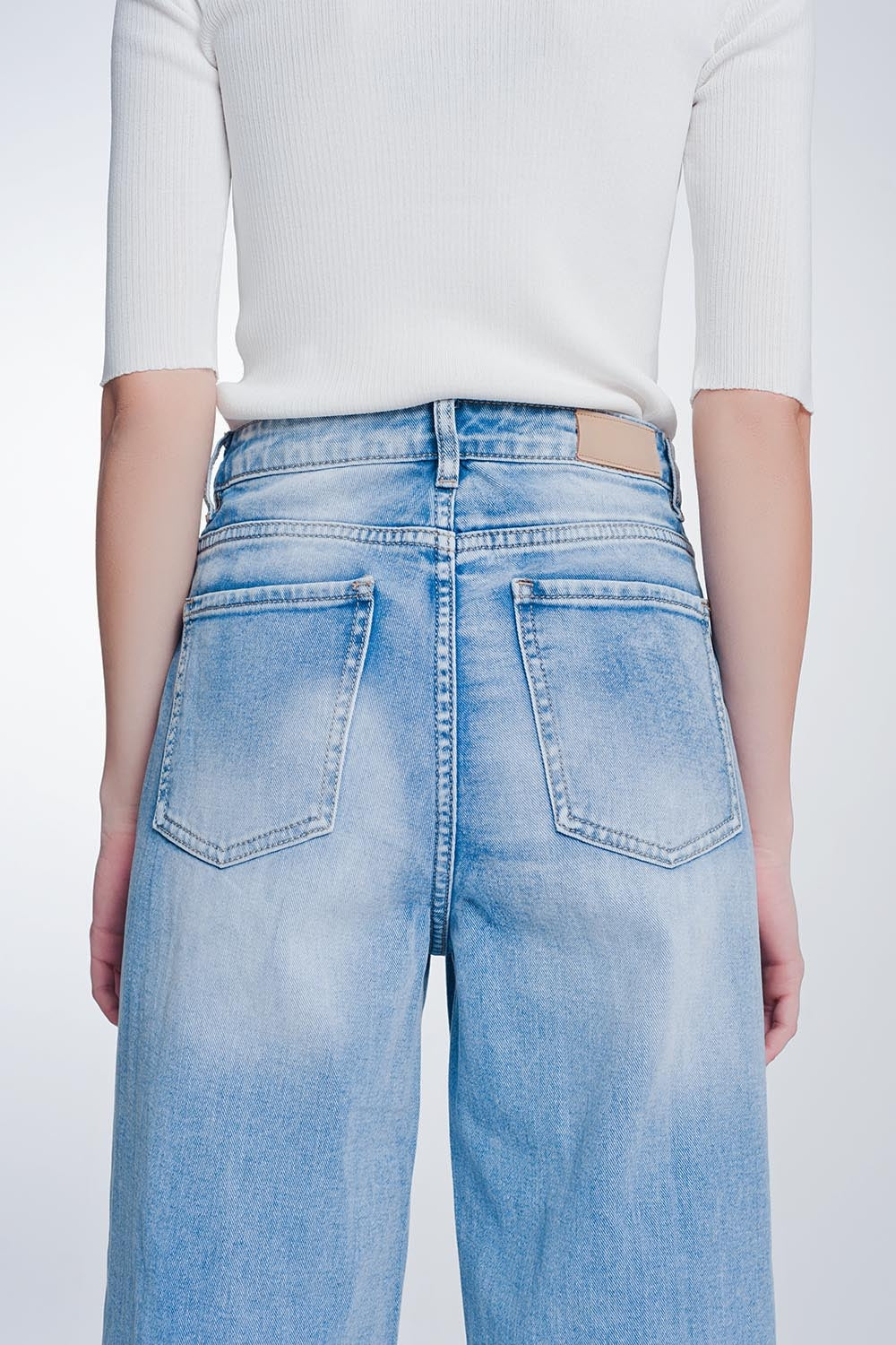 wide leg cropped raw hem jeans in light blue - Denim