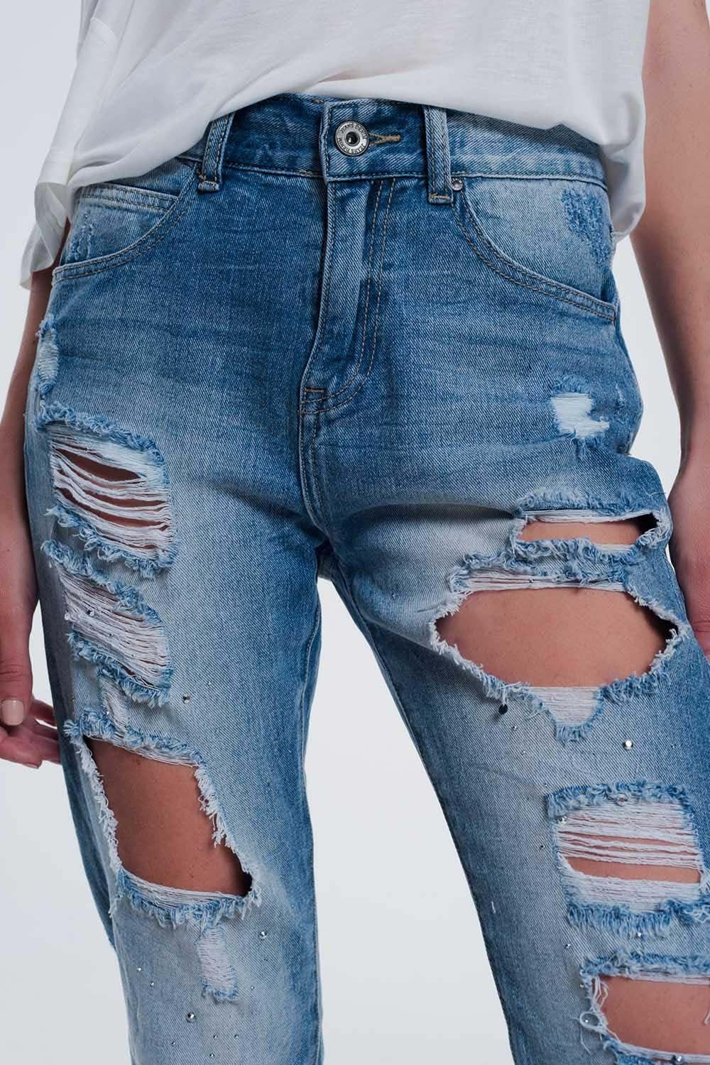 Heavily torn straight jeans in light denim