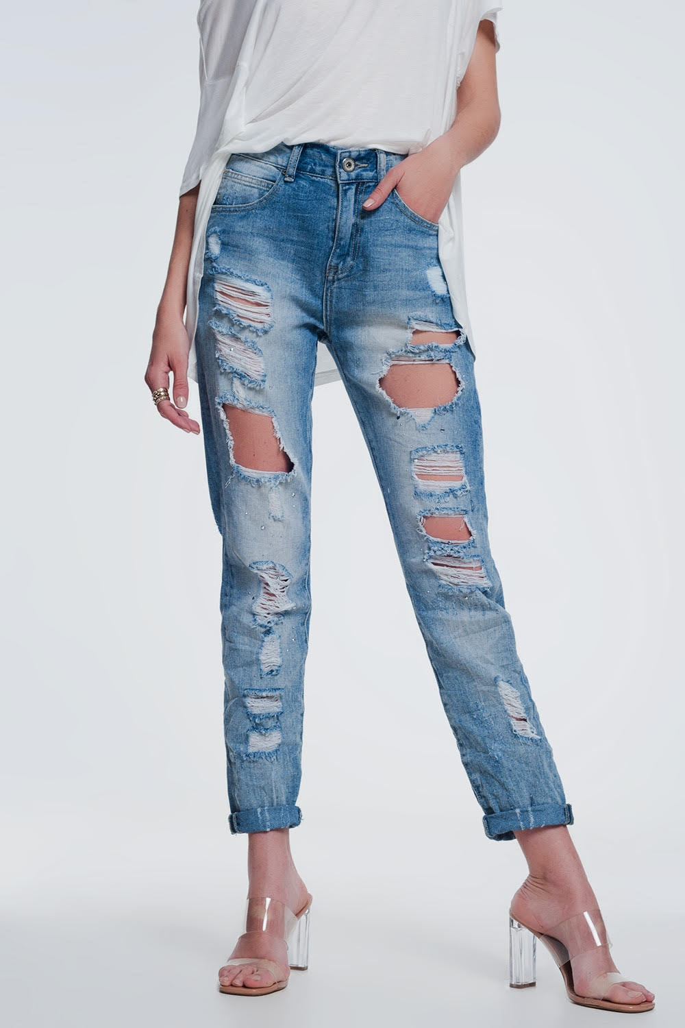 Heavily torn straight jeans in light denim