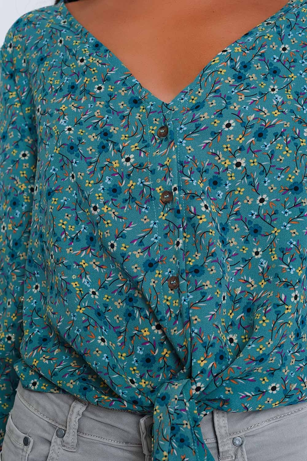 Long sleeve v neck blouse with button detail in green floral print