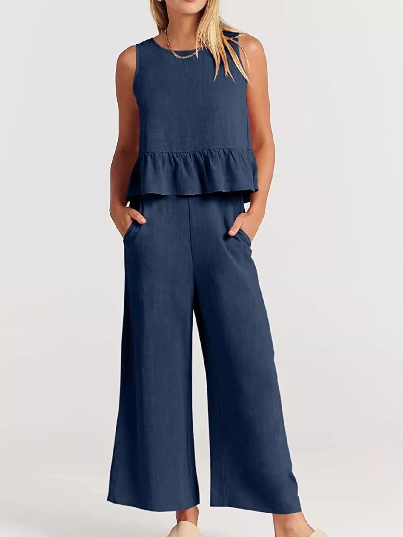 Navy blue set plus size outfit featuring a peplum top and wide-leg trousers with pockets