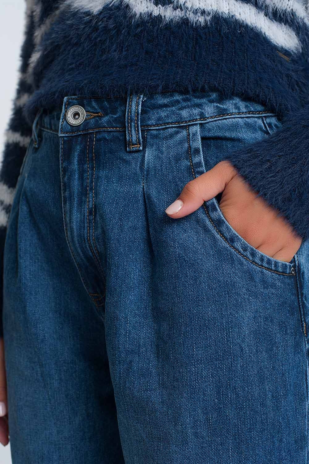 High waisted mom jeans with two ruffles in the waistline in dark wash blue