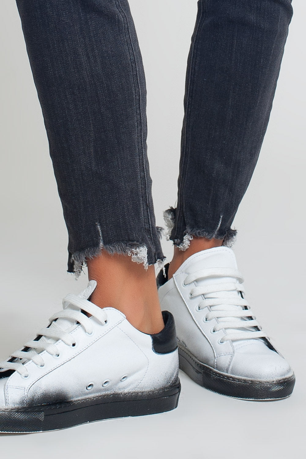 mid rise jeans in black with raw hem - Denim