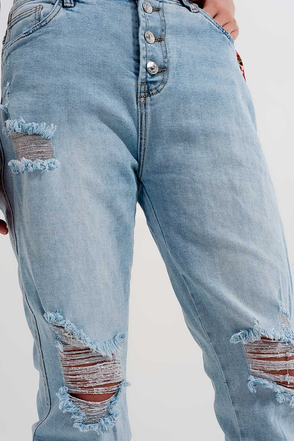 Straight leg distressed jeans with button detail in light blue - Denim