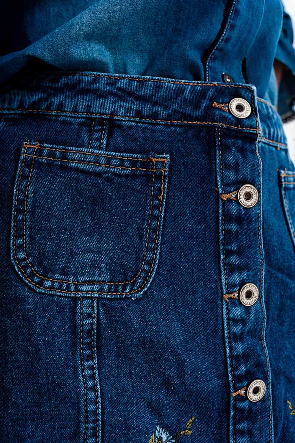 Denim skirt with flower embroidery and front buttons