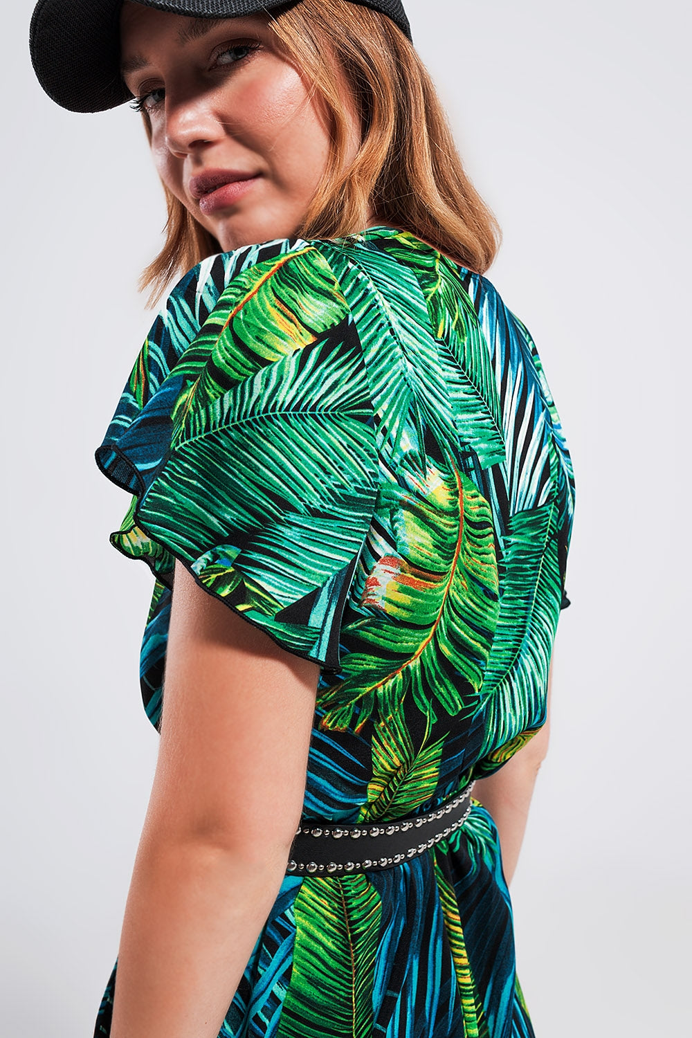 Wrap jumpsuit in green tropical print