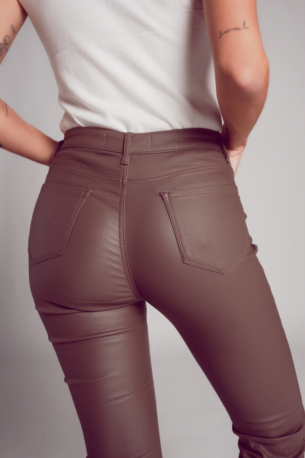 Stretch faux leather flare pants in beige - trousers