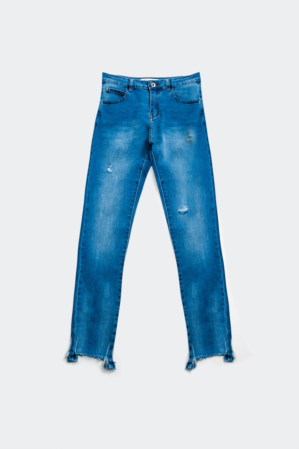 Skinny jeans with ripped hem detail