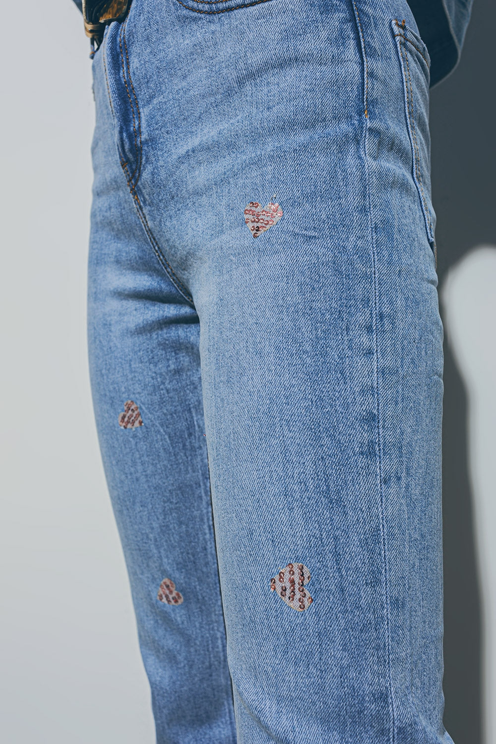 Heart Embellished Jeans with teared hem in Medium Wash - Denim